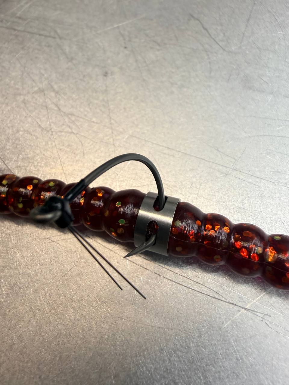 Wacky-Neko Ring rigged on a soft plastic worm with the hook skin-hooked